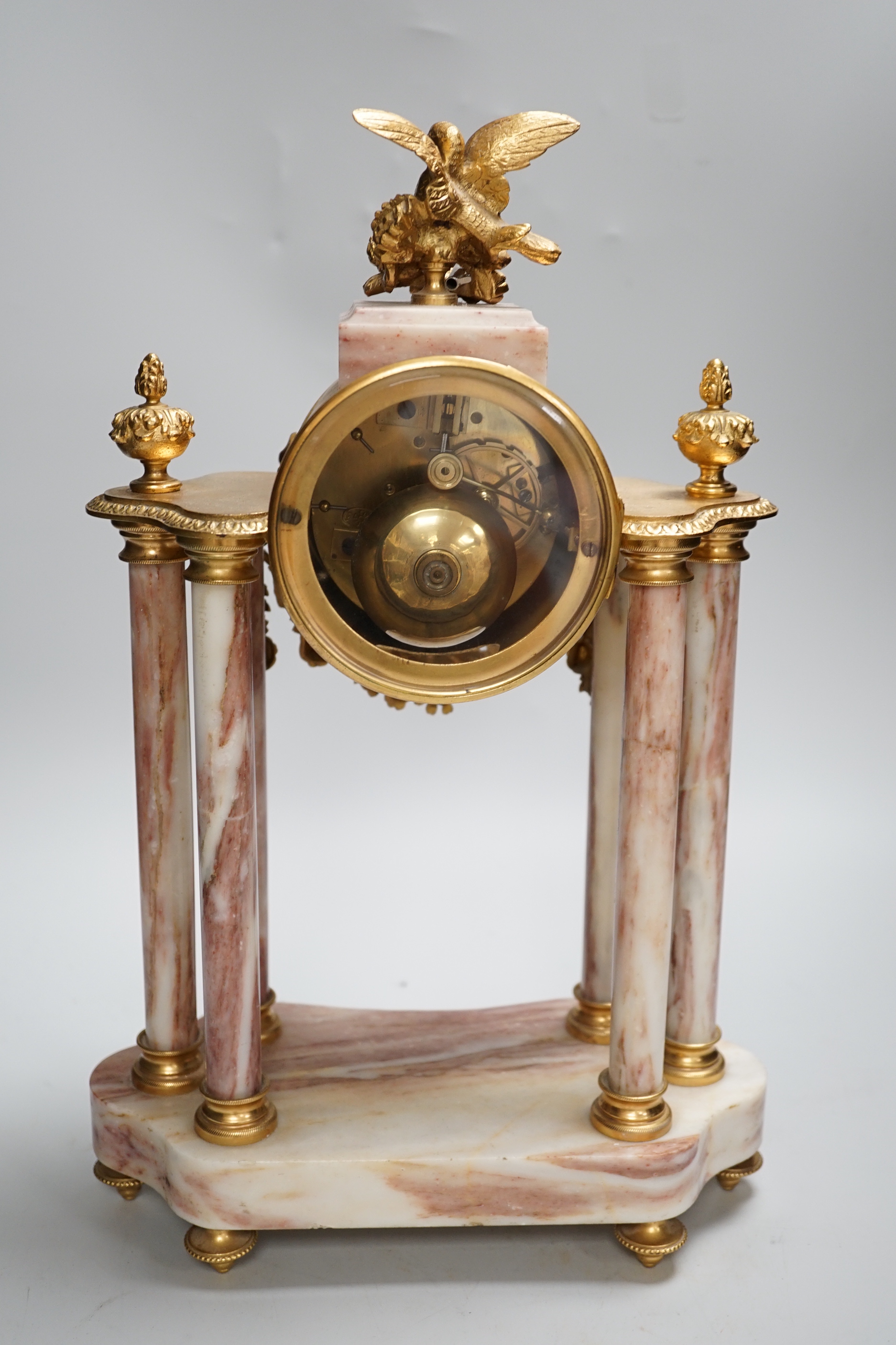 An early 20th century French gilt-metal and marble clock garniture, 38cm high